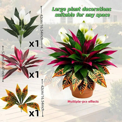 Autumn-themed garden arrangement featuring artificial peace lilies, red dracaena, and orange croton